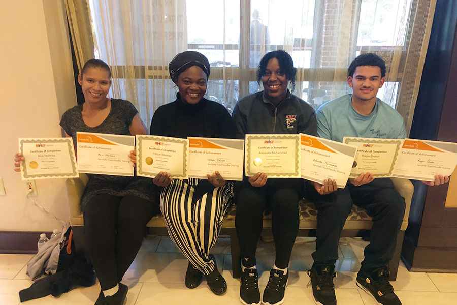 Group photo of graduates with certificates of 2018 Fall Cook Apprenticeship Training